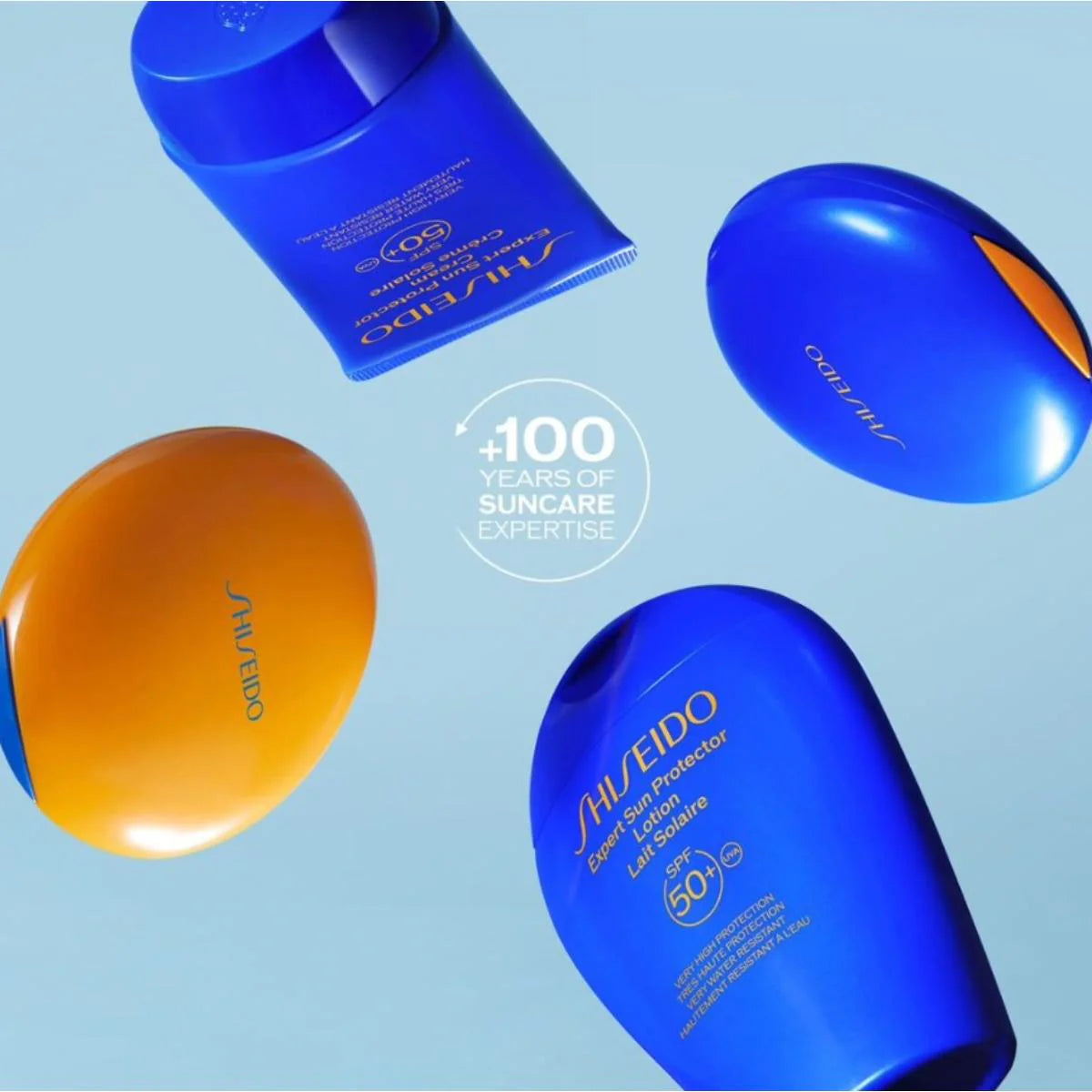 Shiseido sunscreen products on a light blue background with '100 Years of Suncare Expertise' text.