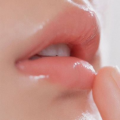 Close-up of a person's lips with a focus on texture and color.