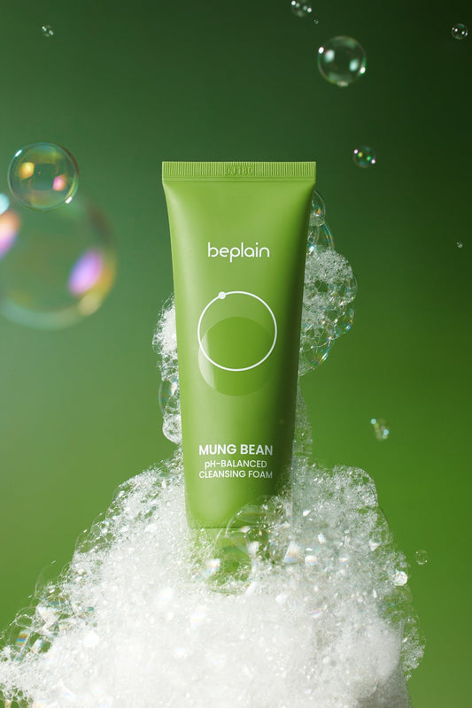 Green tube of beplain Ming Bean PH-Balanced Cleansing Foam with bubbles on a green background