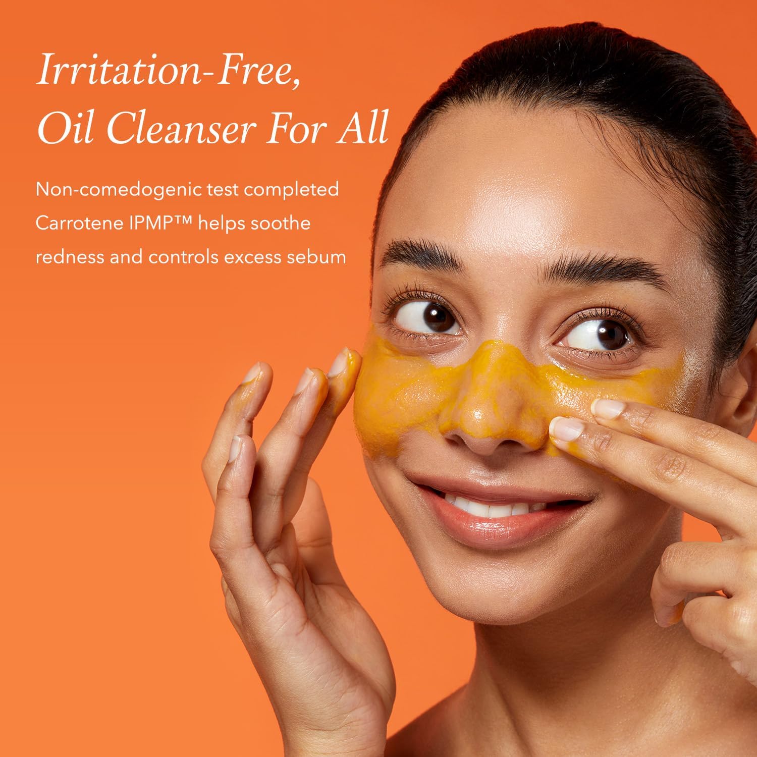 Woman applying a yellow oil cleanser to her face with an orange background and text about the product.