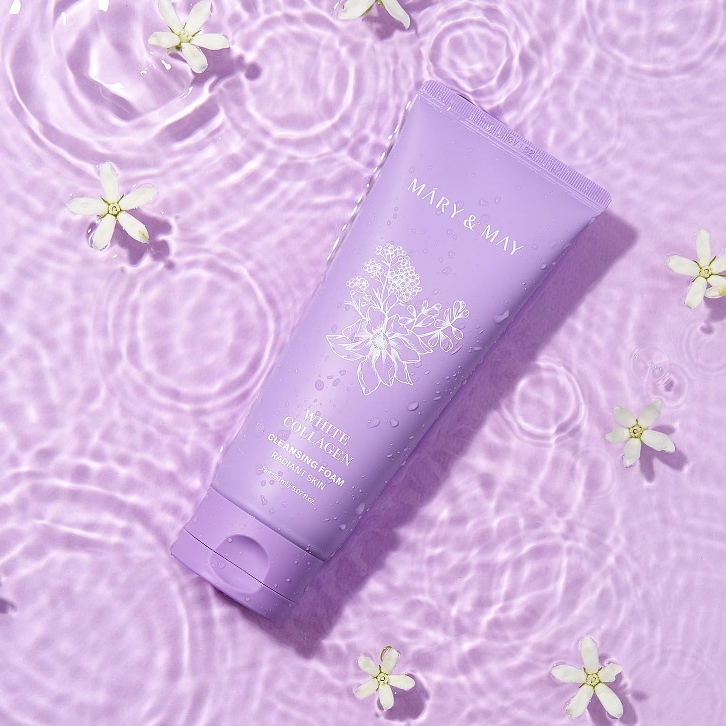 Purple skincare product with floral design on a matching purple background