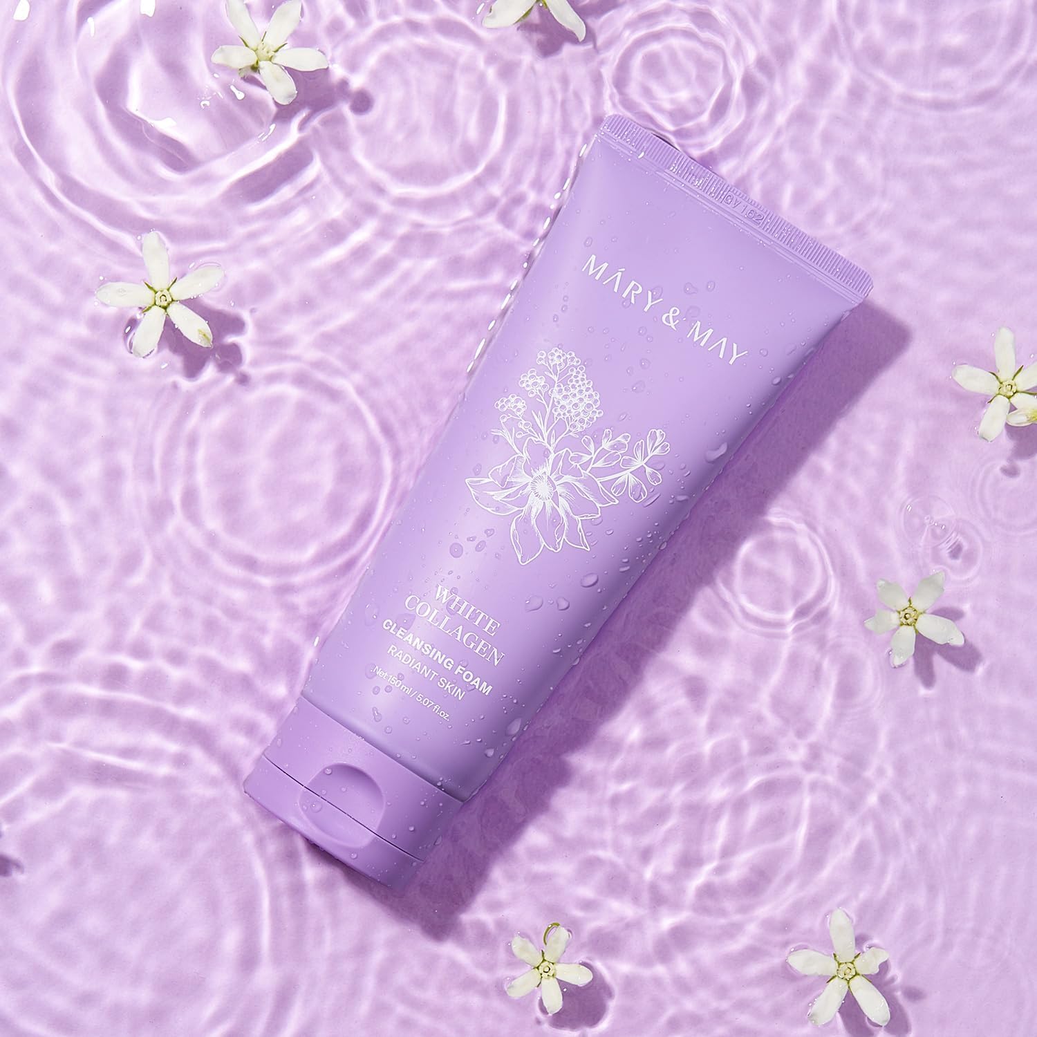 Purple skincare product with floral design on a matching purple background