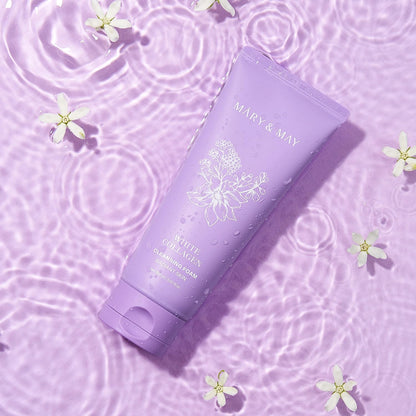 Purple skincare product with floral design on a matching purple background