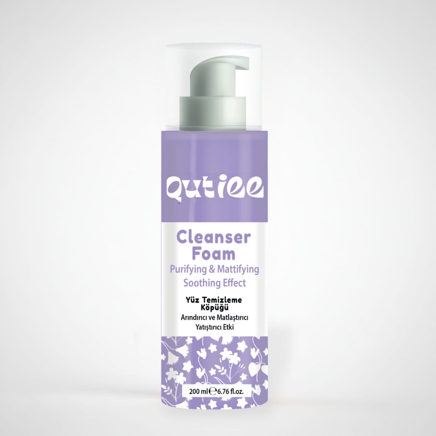 Qutiee Cleanser Foam bottle with purple and white design on a light gray background