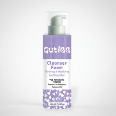 Qutiee Cleanser Foam bottle with purple and white design on a light gray background