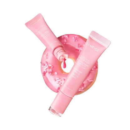 Two pink skincare tubes with a pink circular container in the center on a white background