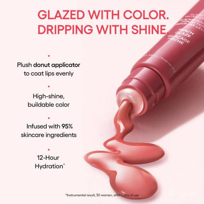 Lip gloss tube with pink lip gloss spilling out, text highlighting features on a white background