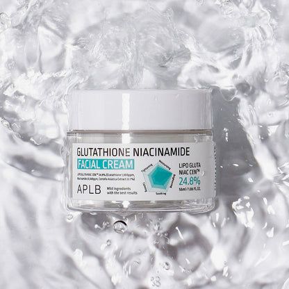 Facial cream jar labeled 'Glutathione Niacinamide' on a water background