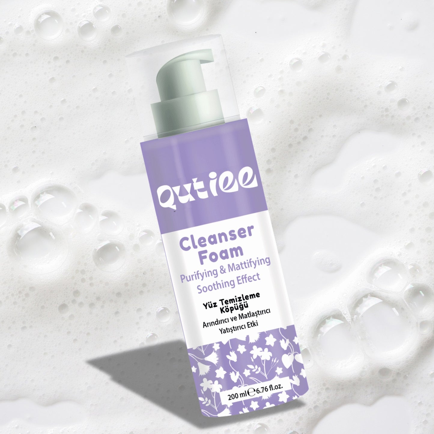 Outiee Cleanser Foam bottle on a textured white background