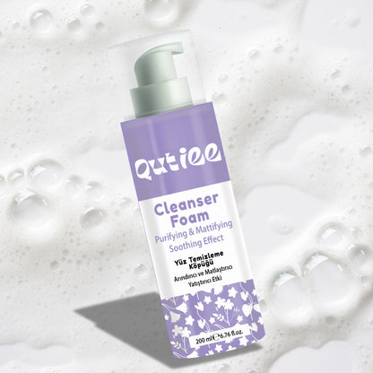 Outiee Cleanser Foam bottle on a textured white background
