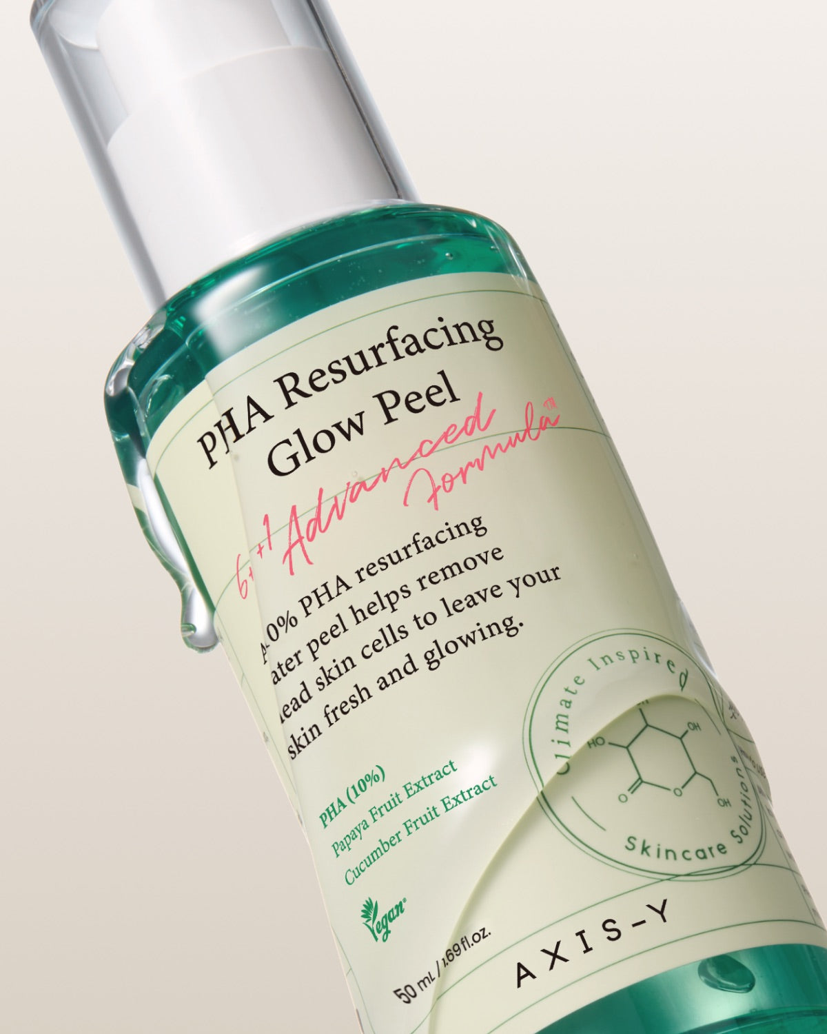 Bottle of AXIS-Y PHA Resurfacing Glow Peel on a beige background