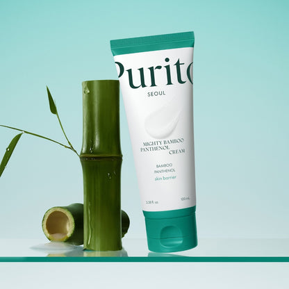 Tube of Purito Mighty Bamboo Panthenol Cream with a bamboo stick on a light blue background