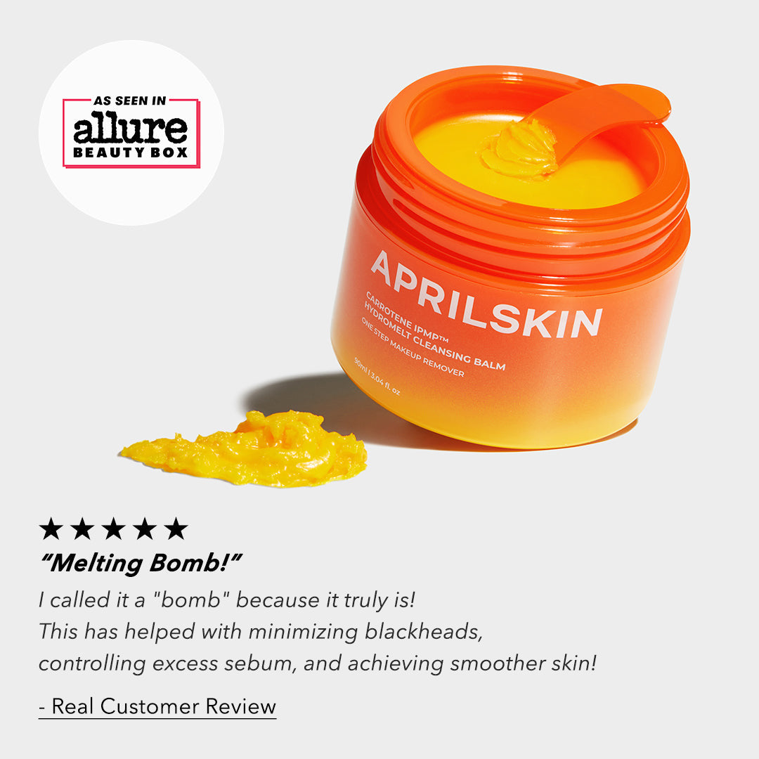 Orange jar of Aprilskin cleansing balm with a spatula on a white background, featuring an Allure Beauty Box logo.