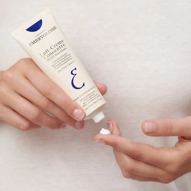 Embry-Olisse skincare product being applied to a finger on a light background