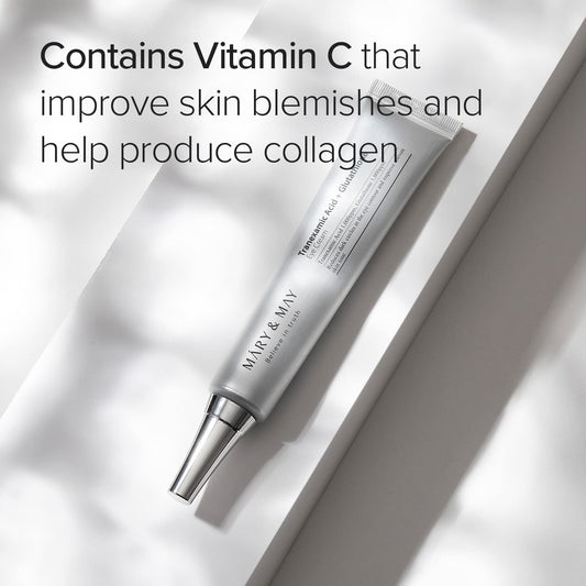 Skincare tube with text about vitamin C benefits on a light background