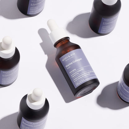 Bottle of 'Mary & Max Marine Collagen' on a white background