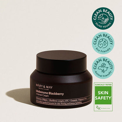 Black jar of skincare cream with 'Mary & May' branding on a beige background, featuring clean beauty certification logos.