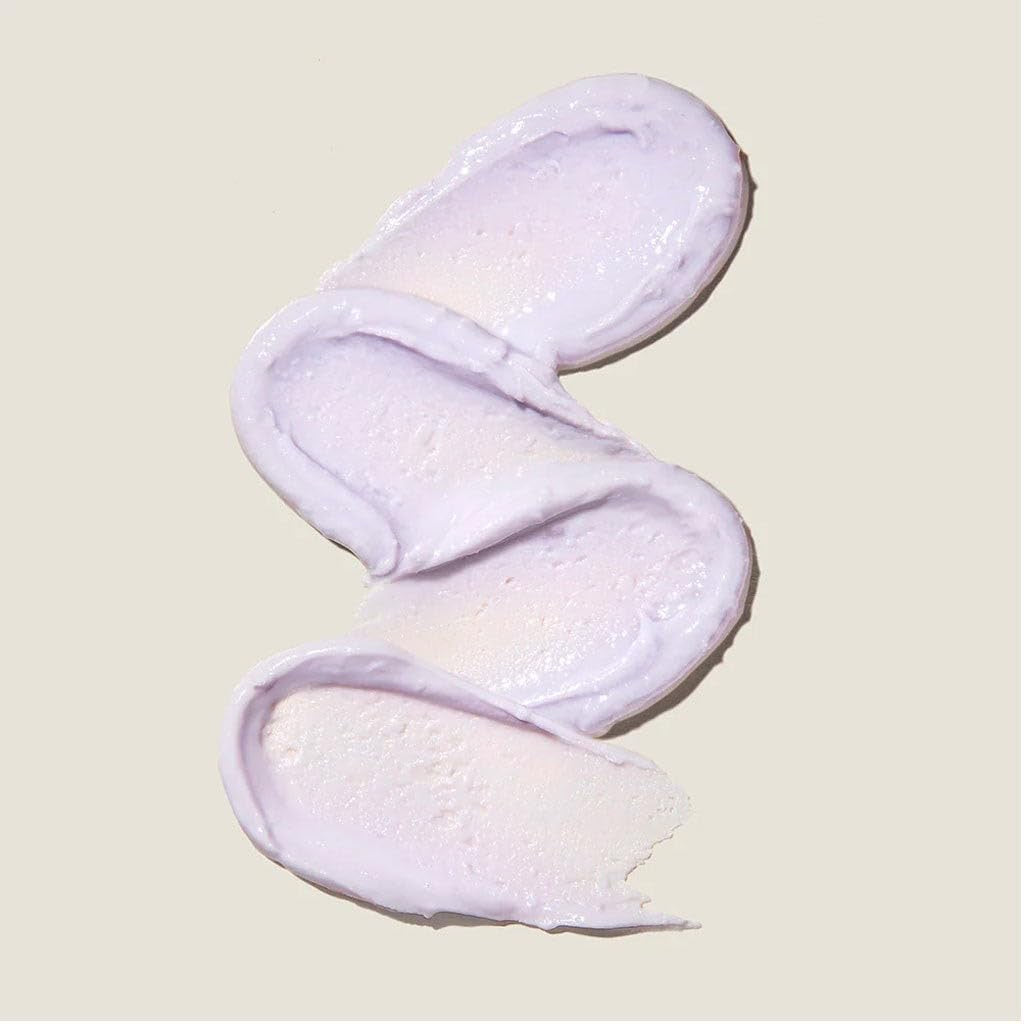 White fluffy slippers on a light beige background