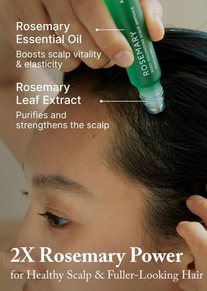 Person applying Rosemary Essential Oil to hair with product labeled
