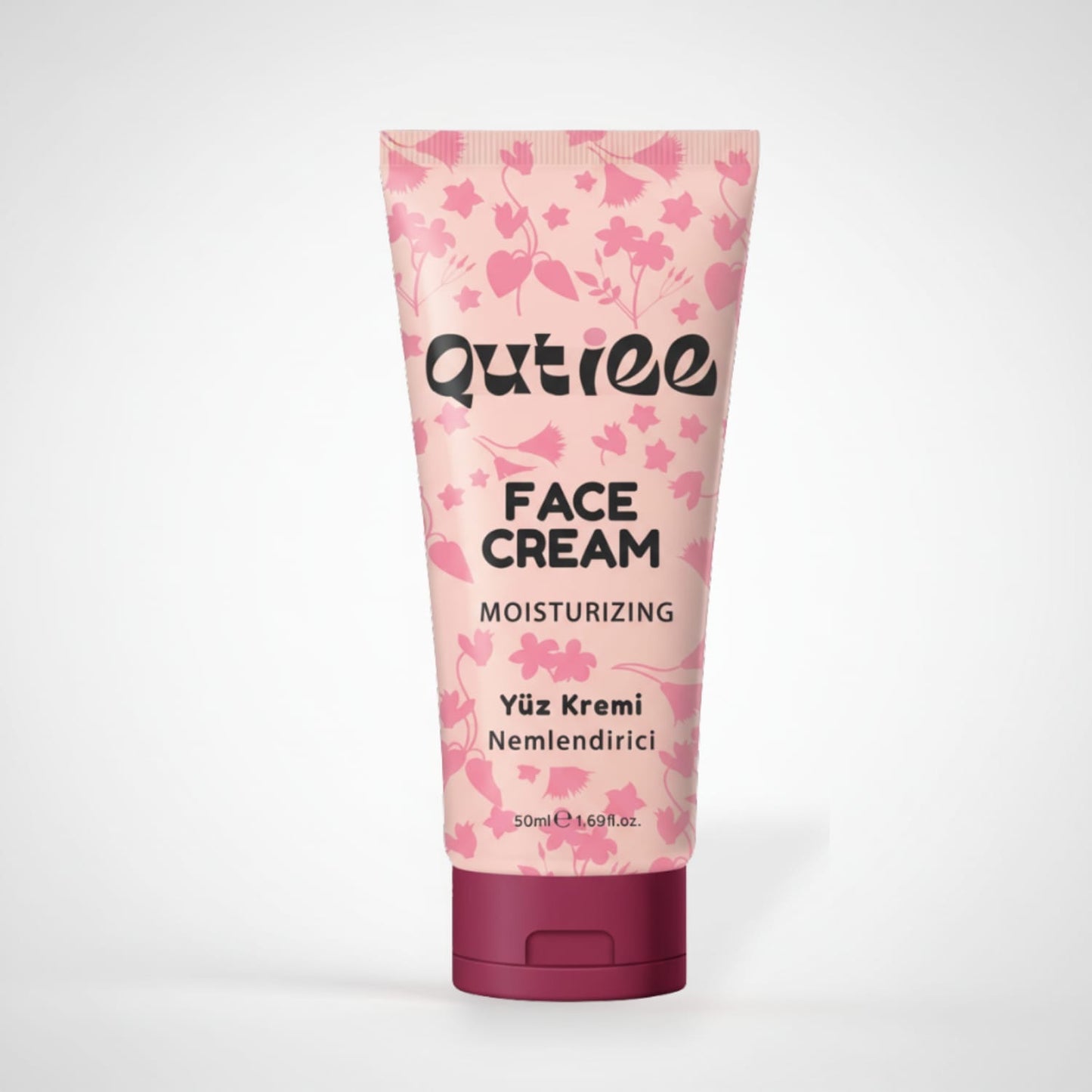 Qutiee moisturizing face cream tube with floral design on a white background