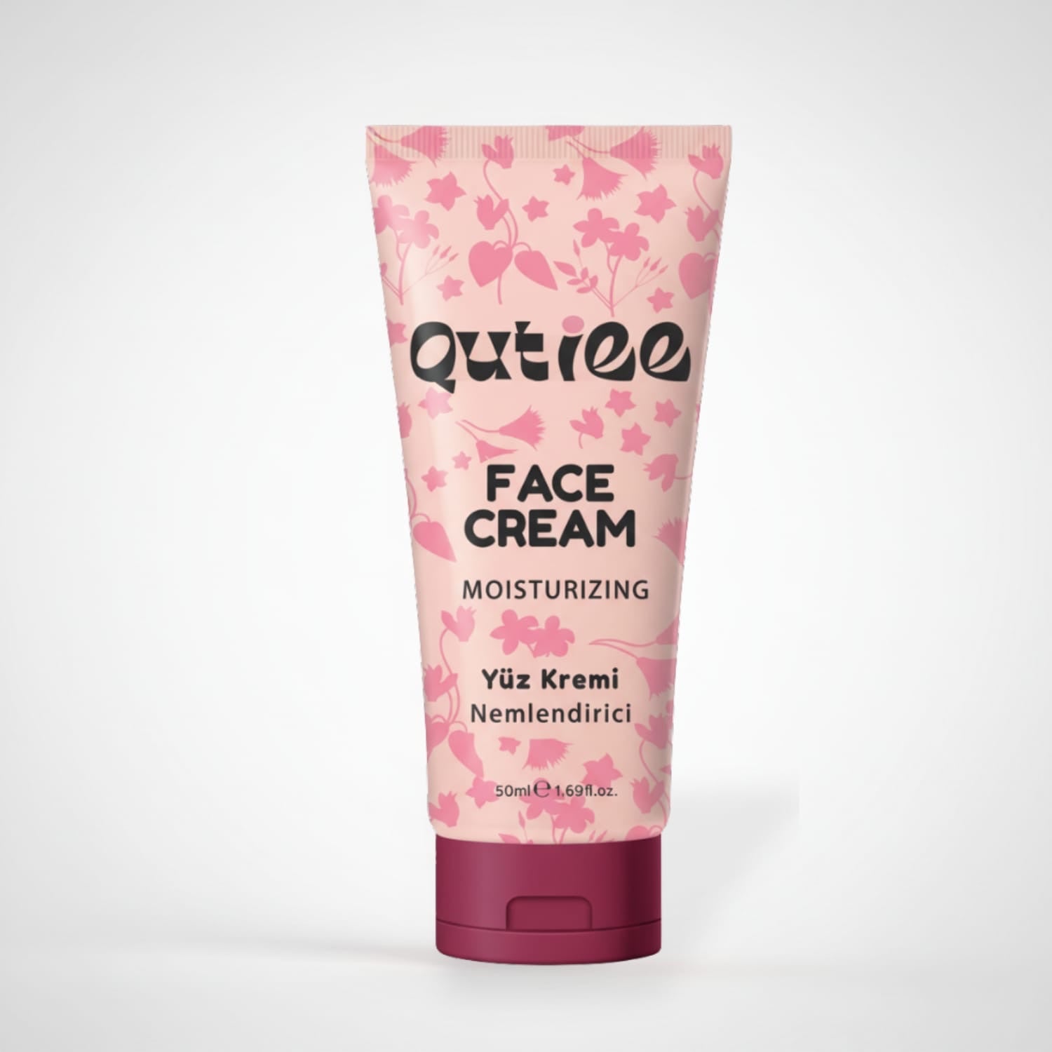 Qutiee moisturizing face cream tube with floral design on a white background